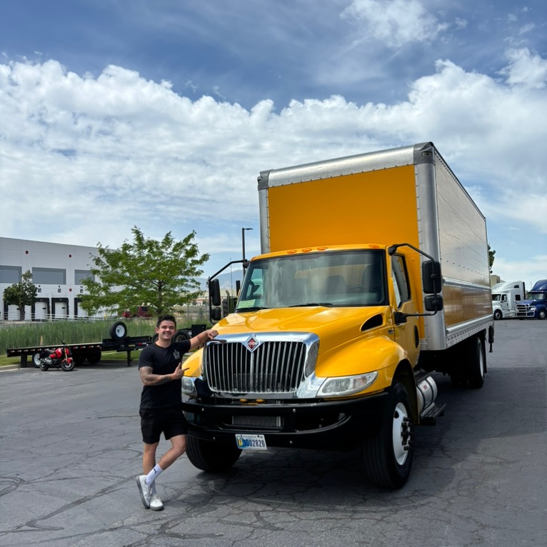 Delivery Dynamics team member with company truck